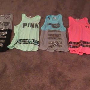 4 PINK Victoria’s Secret tank tops.